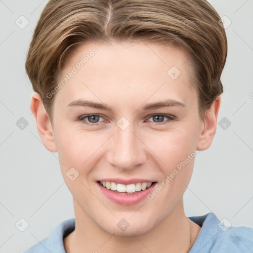 Joyful white young-adult female with short  brown hair and grey eyes