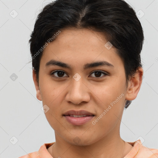 Joyful latino young-adult female with short  brown hair and brown eyes