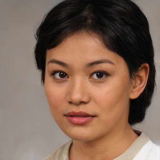 Neutral asian young-adult female with medium  brown hair and brown eyes