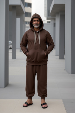 Kuwaiti middle-aged male with  brown hair