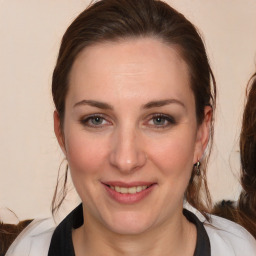 Joyful white young-adult female with medium  brown hair and brown eyes