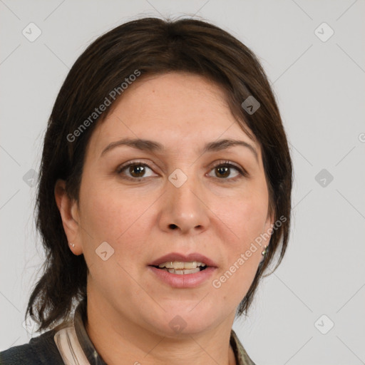 Joyful white adult female with medium  brown hair and grey eyes