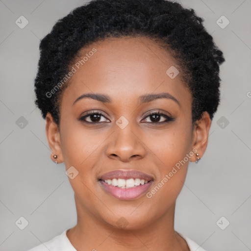 Joyful black young-adult female with short  black hair and brown eyes