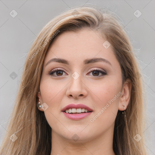 Joyful white young-adult female with long  brown hair and brown eyes