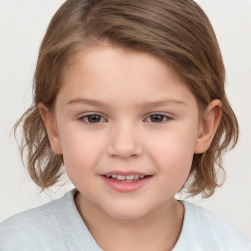 Joyful white child female with medium  brown hair and brown eyes