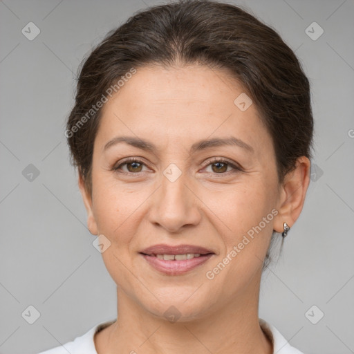 Joyful white adult female with short  brown hair and brown eyes