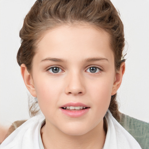 Joyful white child female with short  brown hair and grey eyes