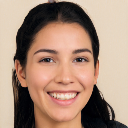 Joyful white young-adult female with long  black hair and brown eyes