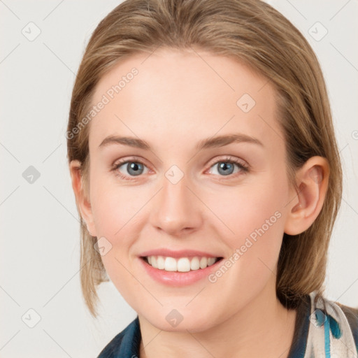 Joyful white young-adult female with medium  brown hair and blue eyes