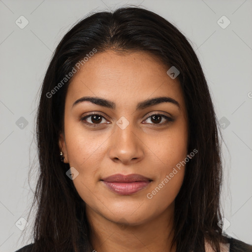 Joyful latino young-adult female with long  brown hair and brown eyes