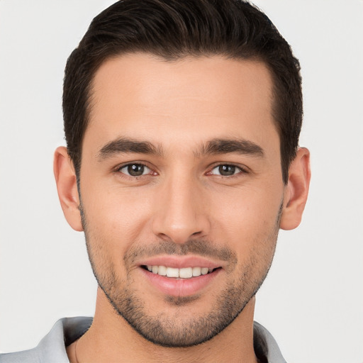 Joyful white young-adult male with short  brown hair and brown eyes