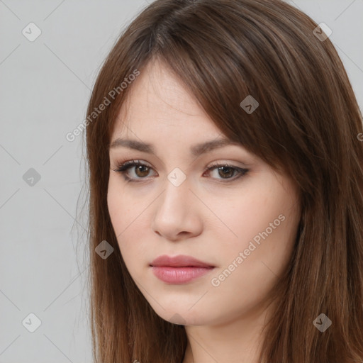 Neutral white young-adult female with long  brown hair and brown eyes