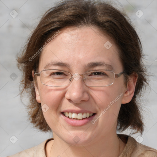 Joyful white adult female with medium  brown hair and grey eyes