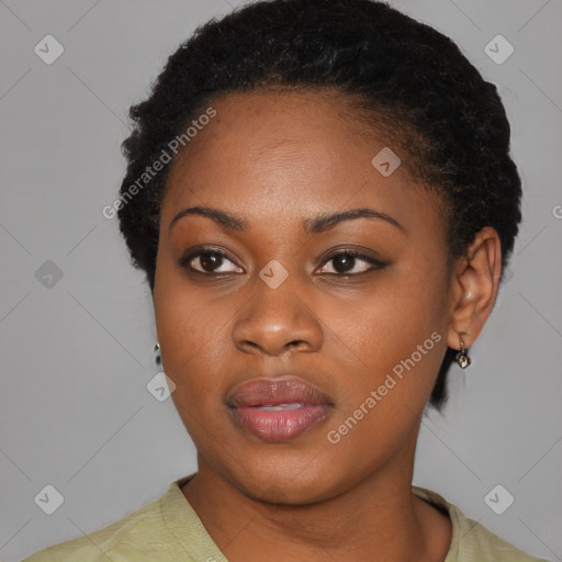 Joyful black young-adult female with short  black hair and brown eyes