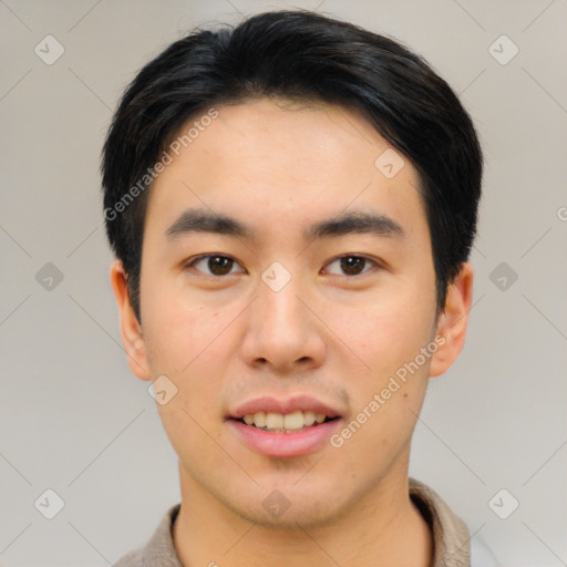 Joyful asian young-adult male with short  black hair and brown eyes