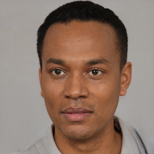 Neutral black young-adult male with short  black hair and brown eyes