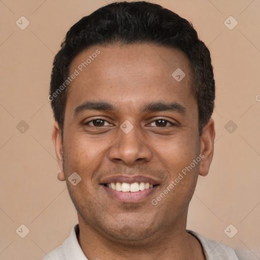 Joyful latino young-adult male with short  black hair and brown eyes