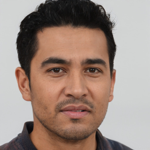 Neutral latino young-adult male with short  black hair and brown eyes