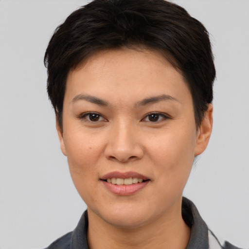 Joyful white young-adult female with short  black hair and brown eyes