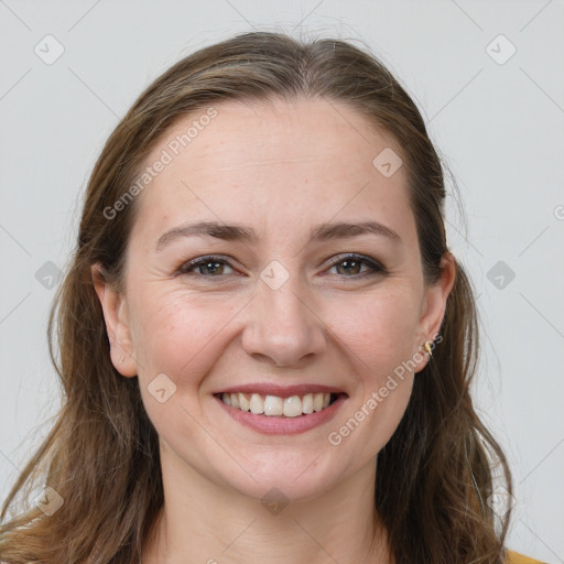 Joyful white young-adult female with long  brown hair and brown eyes