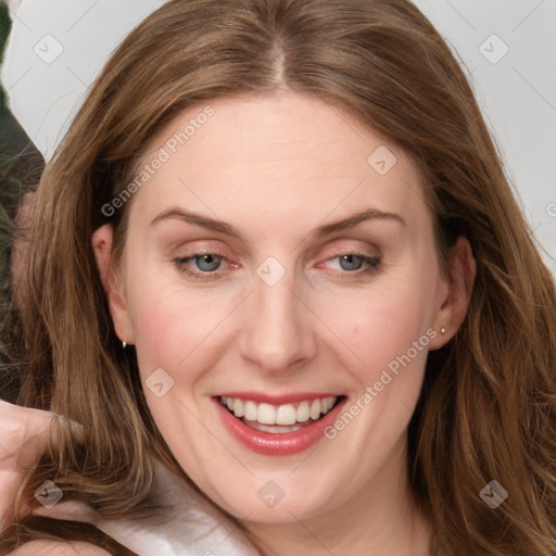 Joyful white young-adult female with long  brown hair and blue eyes