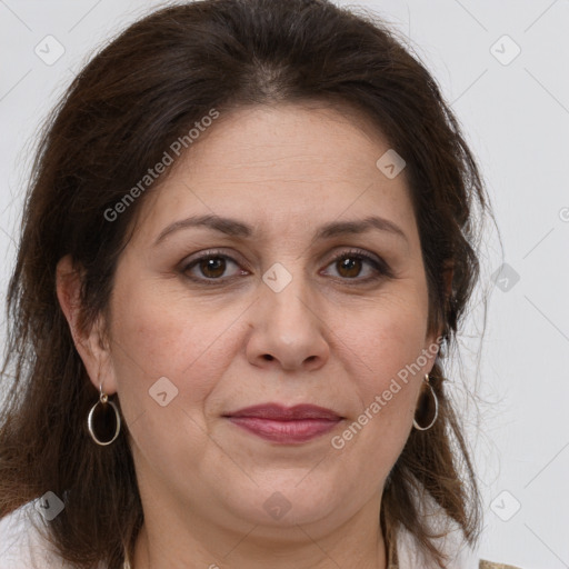 Joyful white adult female with medium  brown hair and brown eyes