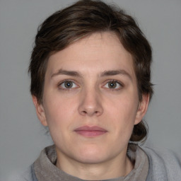 Neutral white young-adult female with short  brown hair and brown eyes