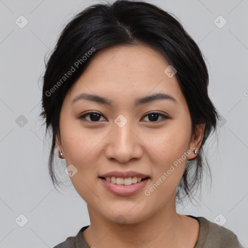 Joyful asian young-adult female with medium  black hair and brown eyes