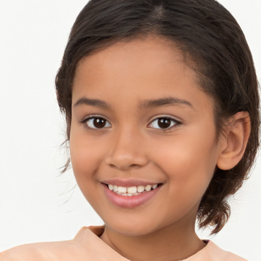 Joyful white child female with medium  brown hair and brown eyes