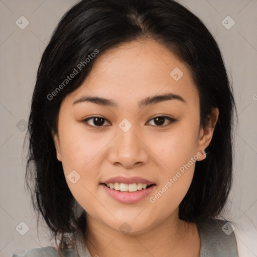 Joyful asian young-adult female with medium  black hair and brown eyes