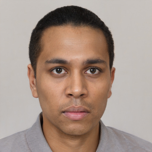 Neutral latino young-adult male with short  black hair and brown eyes
