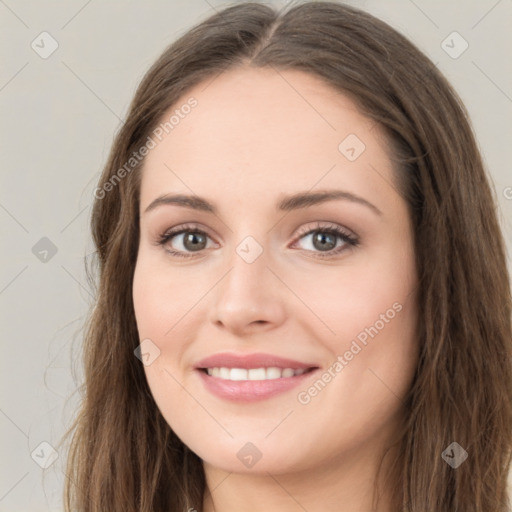 Joyful white young-adult female with long  brown hair and green eyes