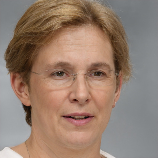 Joyful white middle-aged female with short  brown hair and blue eyes