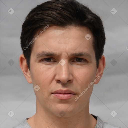 Joyful white adult male with short  brown hair and brown eyes