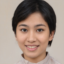 Joyful asian young-adult female with medium  black hair and brown eyes