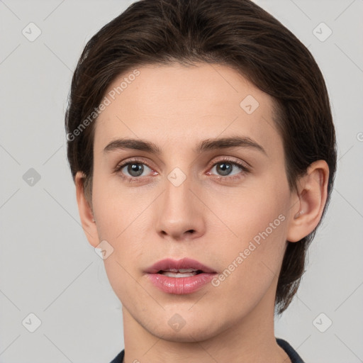 Neutral white young-adult female with short  brown hair and brown eyes