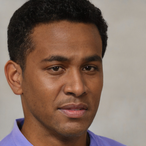 Neutral latino young-adult male with short  brown hair and brown eyes