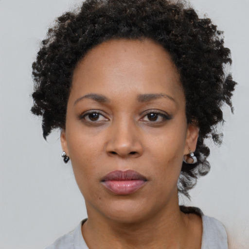 Neutral black adult female with short  black hair and brown eyes