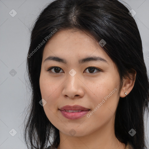 Joyful asian young-adult female with long  brown hair and brown eyes