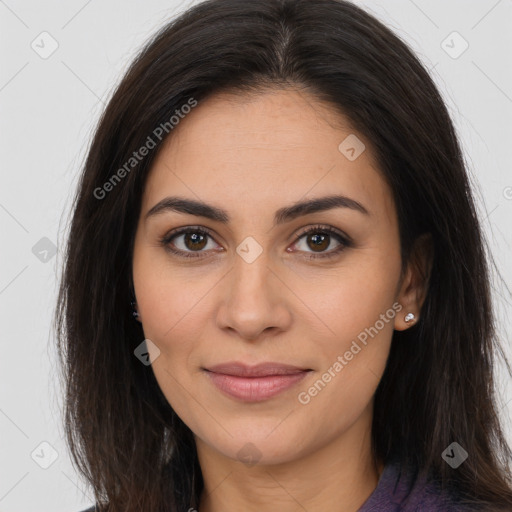 Joyful latino young-adult female with long  brown hair and brown eyes