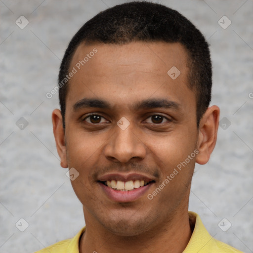 Joyful latino young-adult male with short  black hair and brown eyes