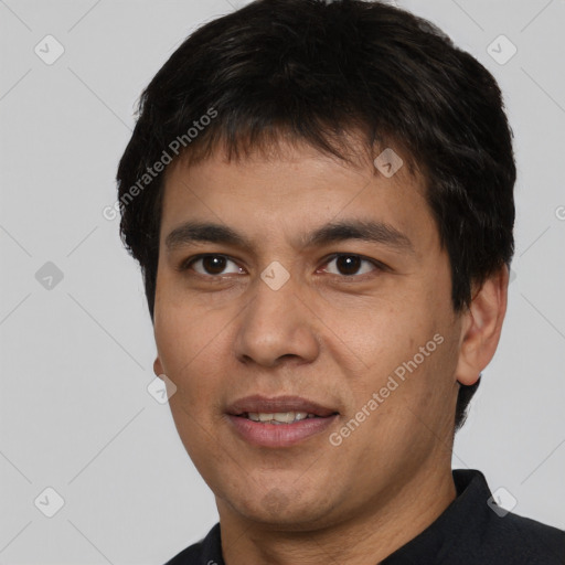 Joyful white young-adult male with short  black hair and brown eyes