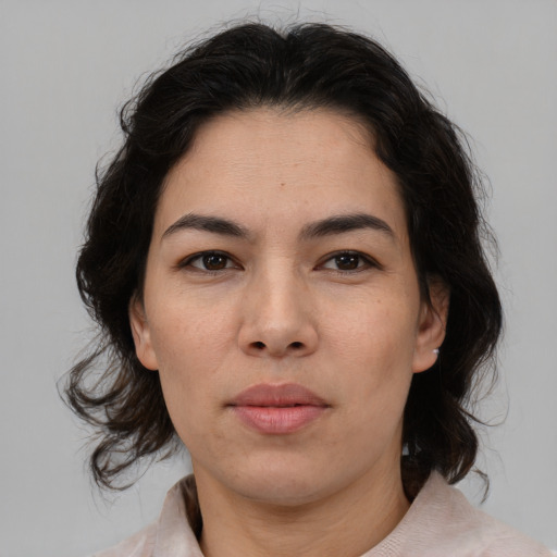 Neutral asian adult female with medium  brown hair and brown eyes