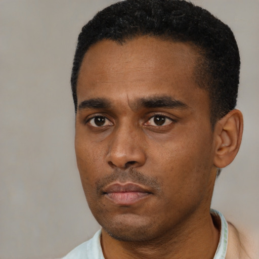 Neutral black young-adult male with short  black hair and brown eyes