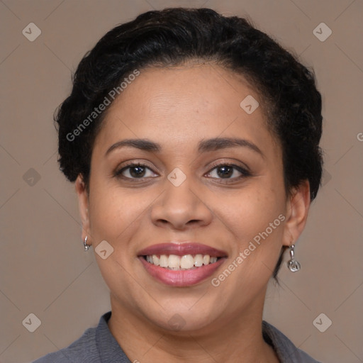 Joyful latino adult female with short  brown hair and brown eyes