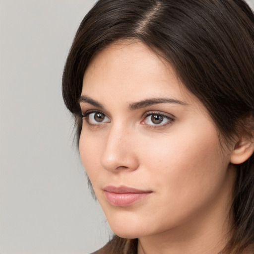 Neutral white young-adult female with medium  brown hair and brown eyes