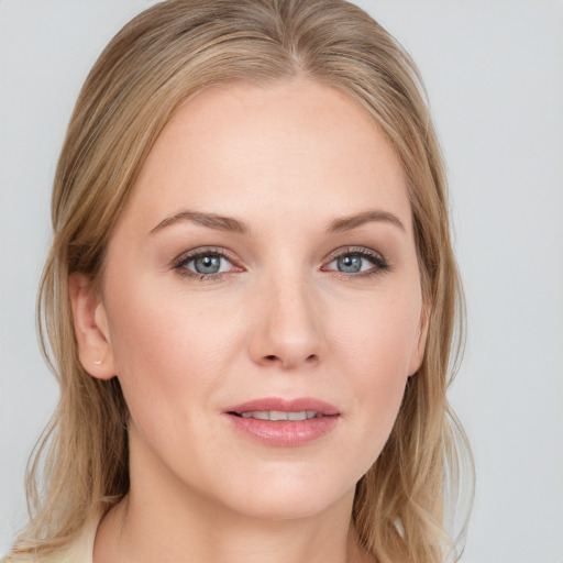 Joyful white young-adult female with medium  brown hair and blue eyes