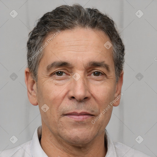 Joyful white middle-aged male with short  brown hair and brown eyes