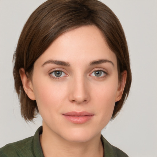 Neutral white young-adult female with medium  brown hair and green eyes