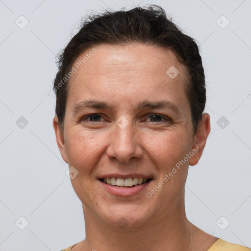 Joyful white adult female with short  brown hair and brown eyes